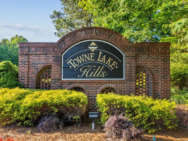 Homes for Sale in Towne Lake Hills East - monument sign at the entrance to Towne Lake Hills East